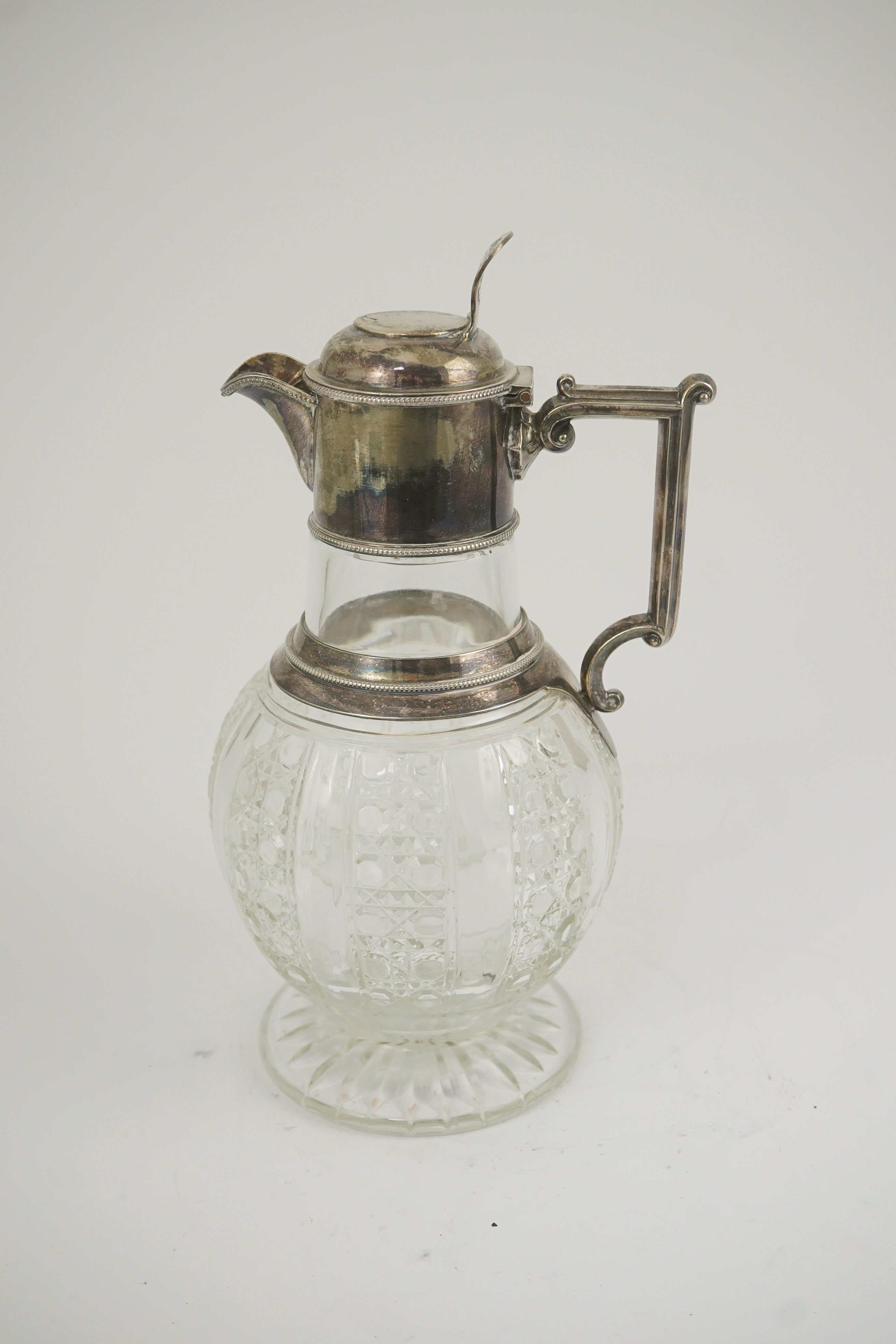 A late Victorian silver mounted cut glass claret jug, by Edward Hutton